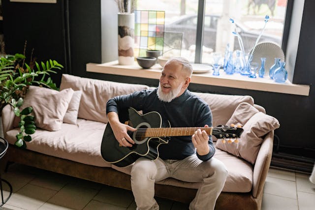 A resident playing guitar