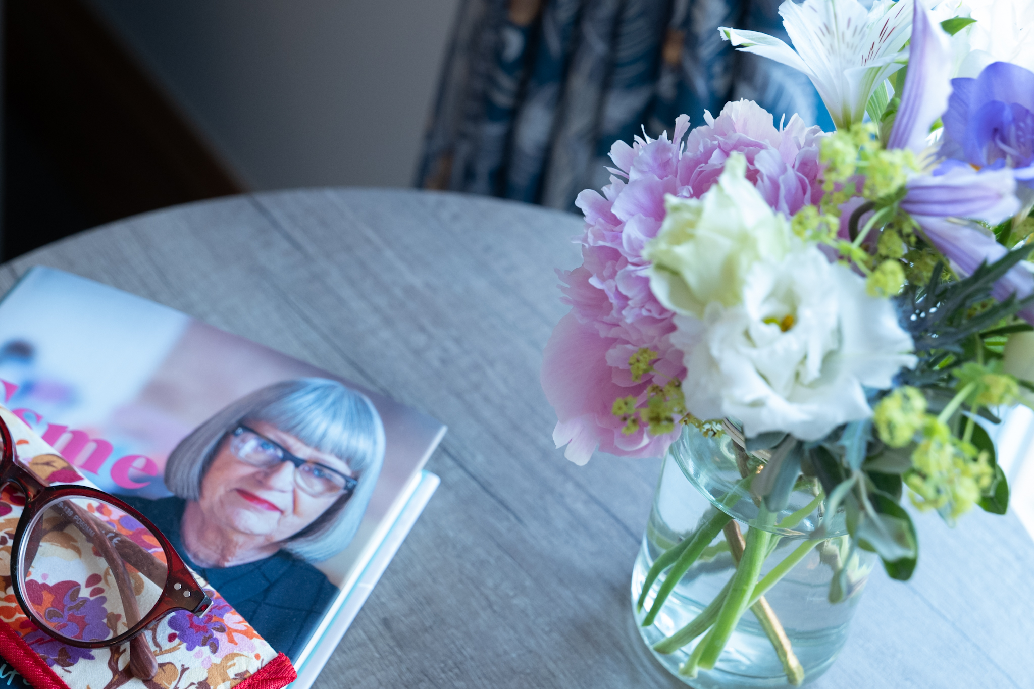 Glasses on Magazine and Flowers