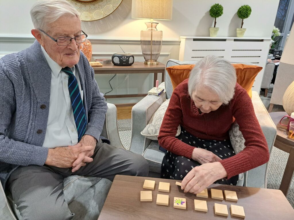 Two residents playing a game together.