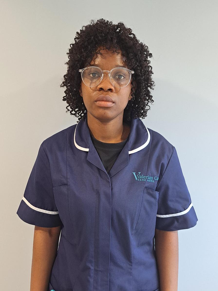 Doris Amponsah team member in nurses uniform