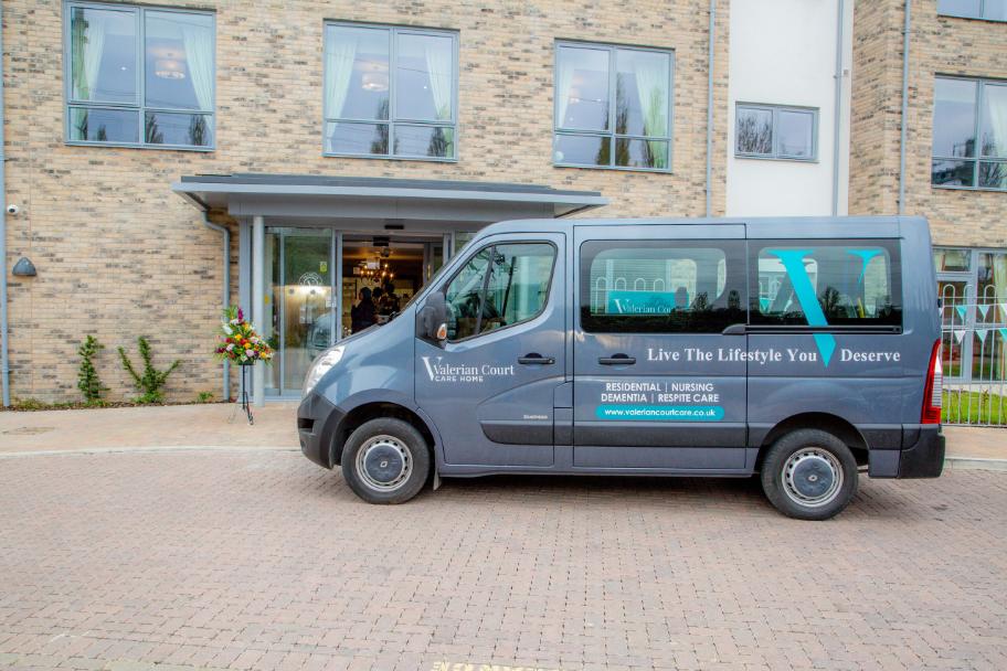 A Valerian Court mini bus outside of the home.