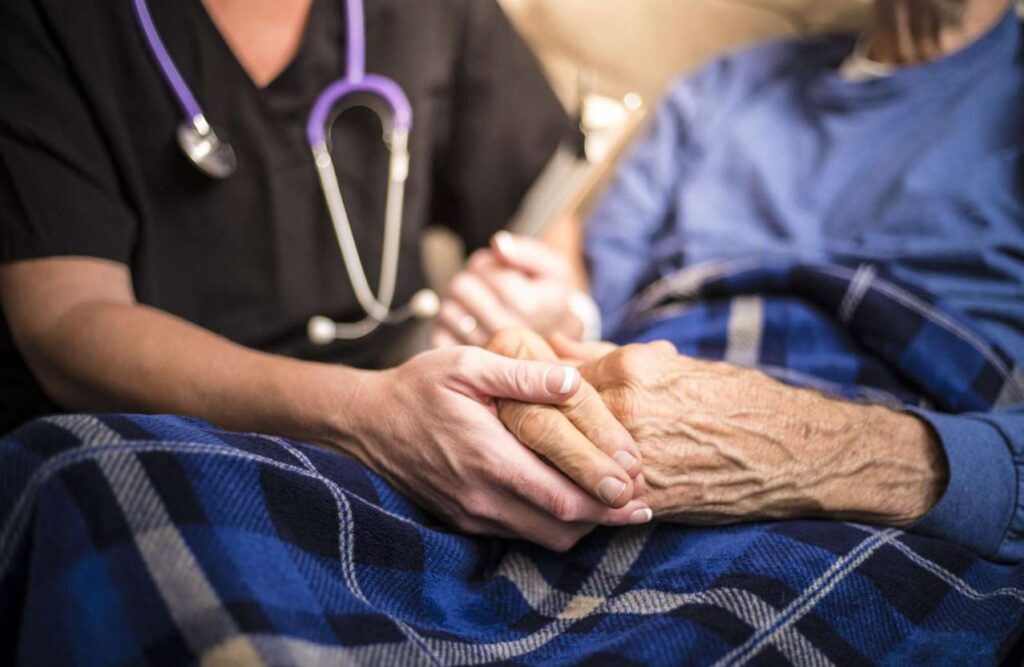 Nurse helping resident