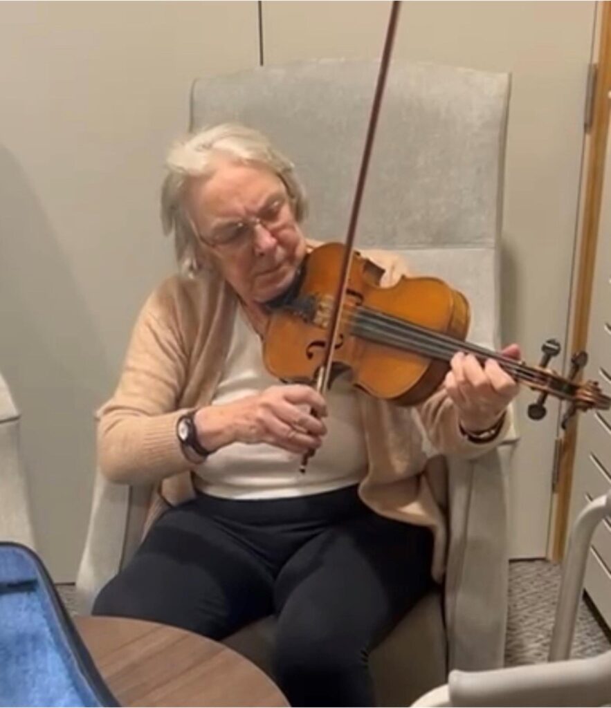 resident playing the violin