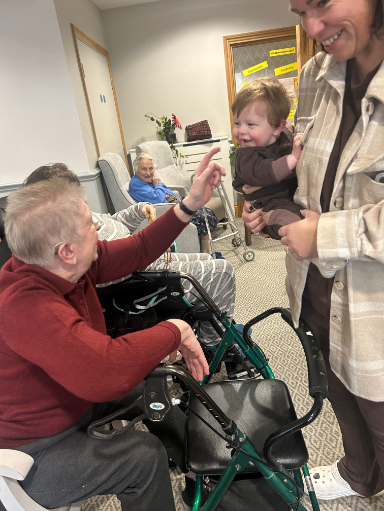 resident interacting with young child