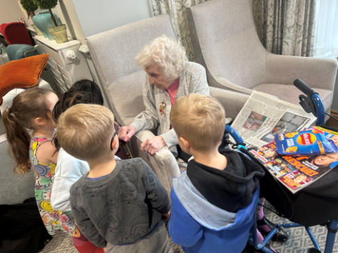 resident interacting with young child