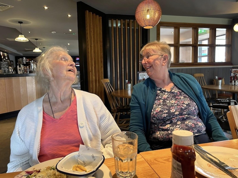 2 of our residents looking at each other smiling