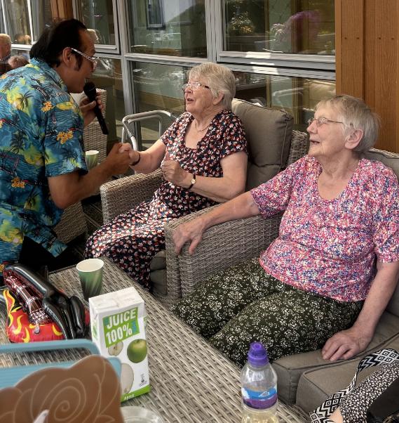 man singing to two ladies
